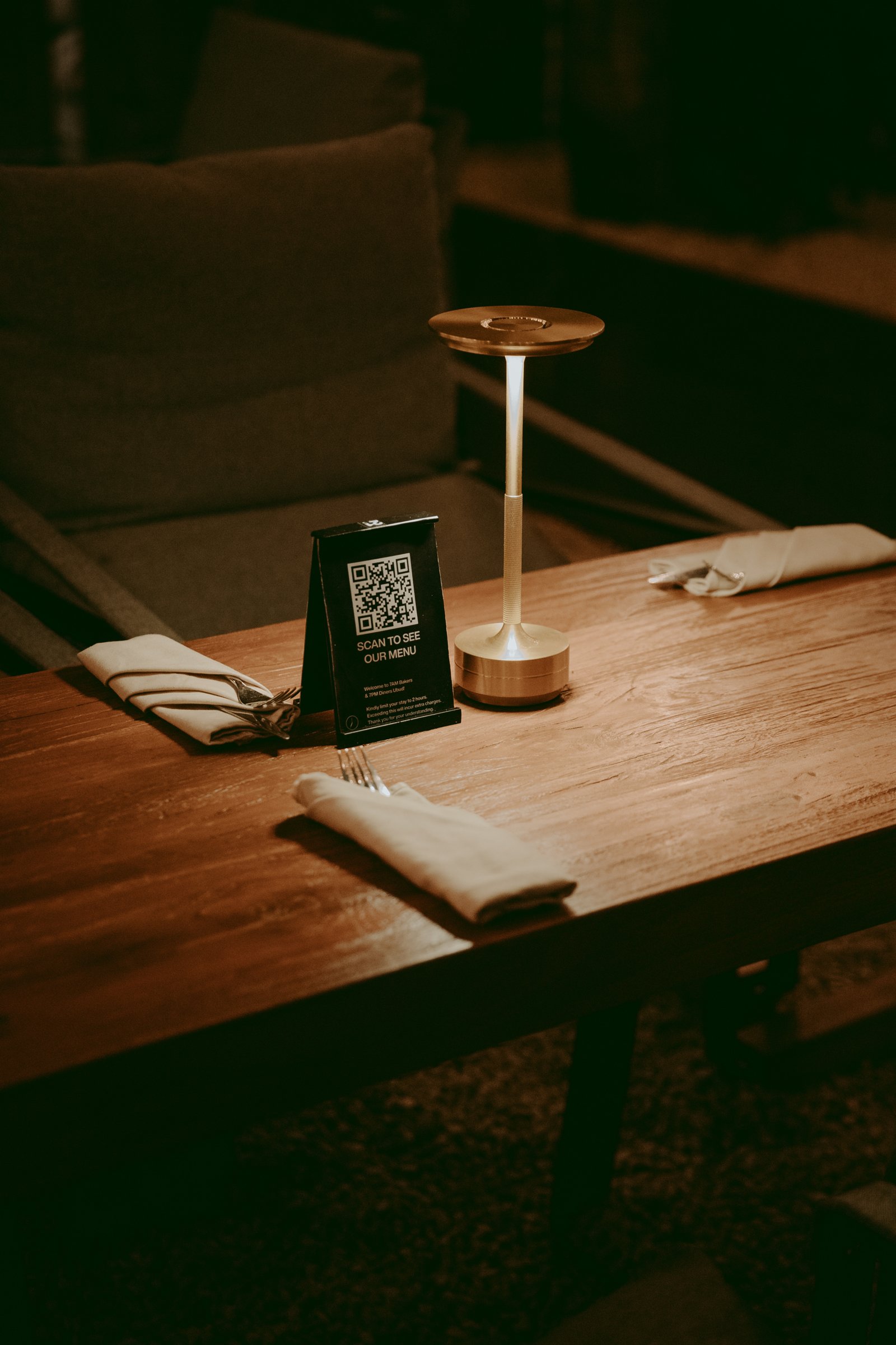 Current 7AM QR menu stand on a dining table
